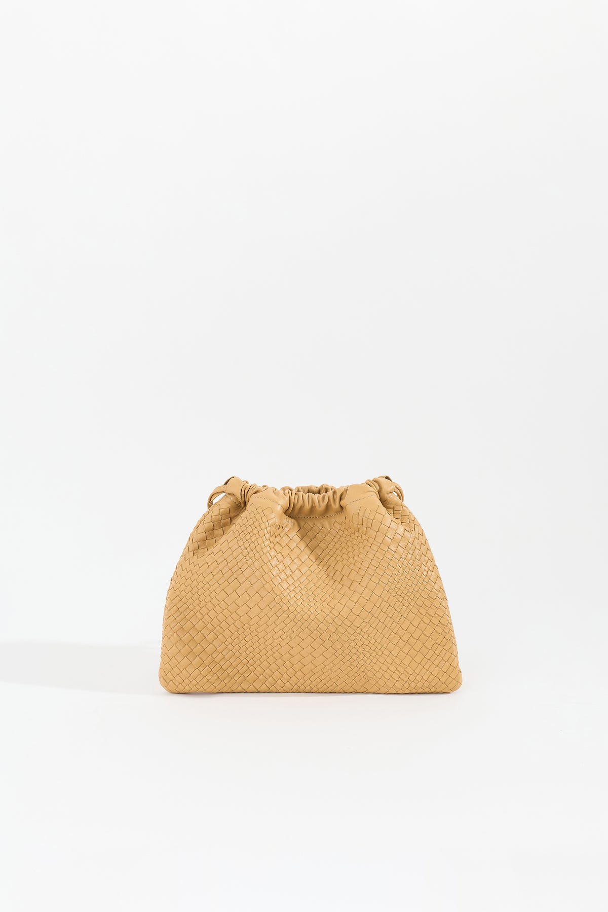 ANYA handwoven nappa leather drawstring bag in Sand by Narii